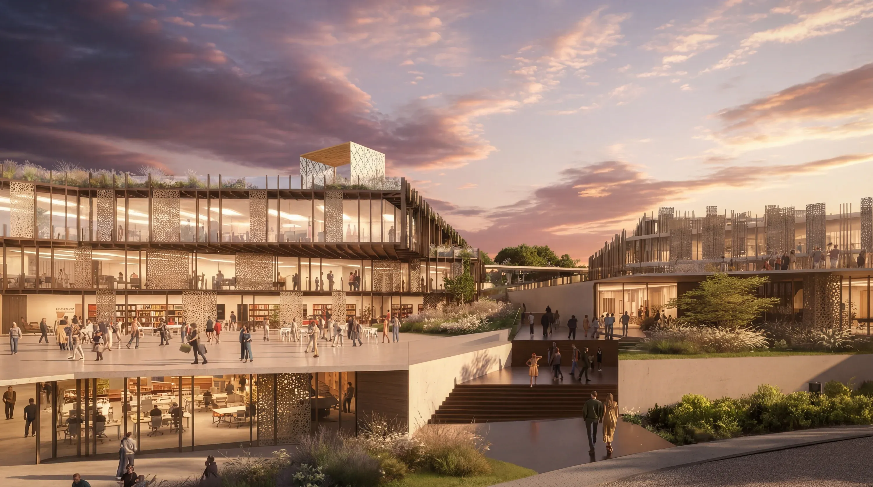 The multi-level Mira Verde campus plaza with open stairs and library shelving at sunset