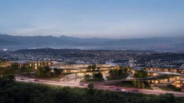 Aerial view of Mira Verde at dusk, its low-rise residences following the hillside above Tbilisi