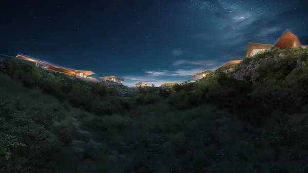 Mira Verde residences lit along the ridge under a night sky