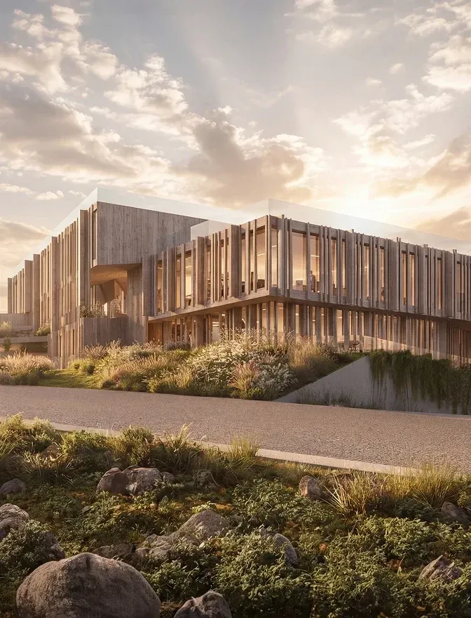 A timber-clad Mira Verde building in golden-hour light